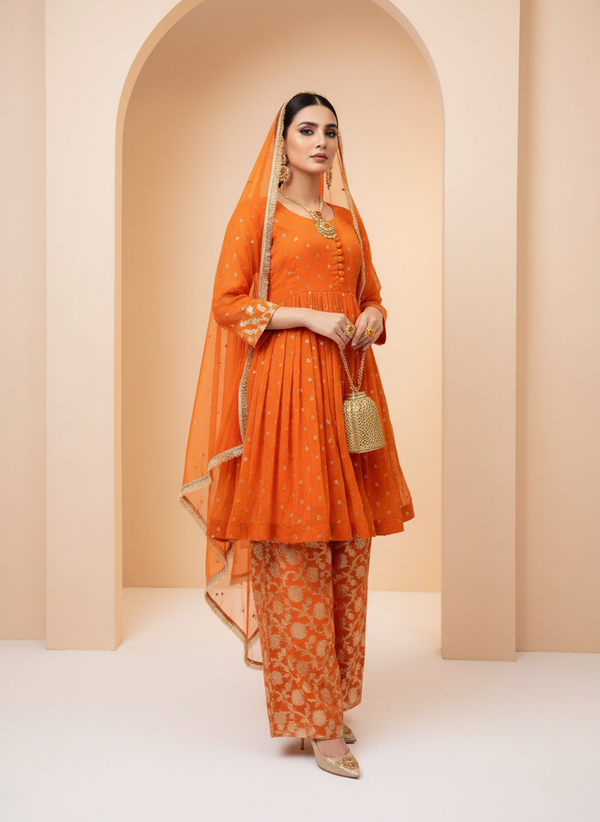 Vibrant Orange Kurta with Golden Embroidery and Matching Pants