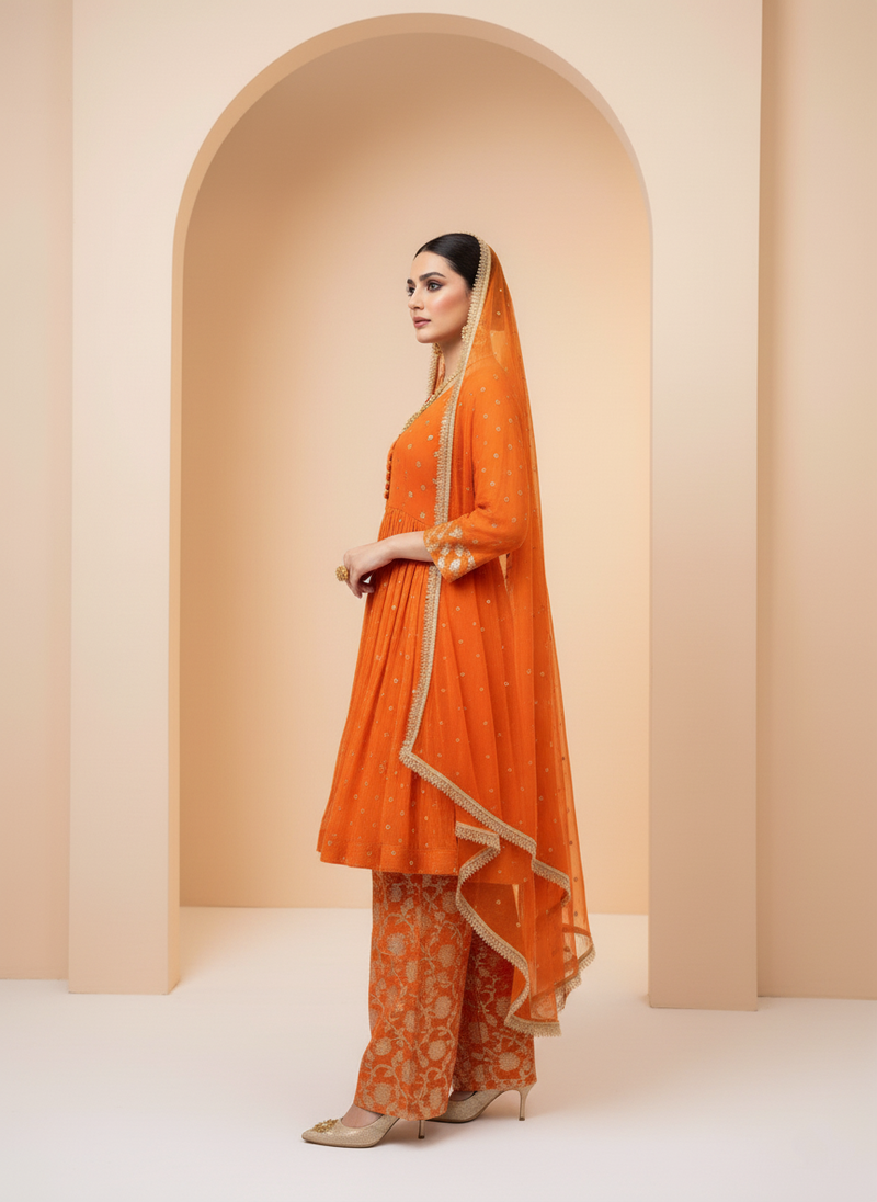 Vibrant Orange Kurta with Golden Embroidery and Matching Pants